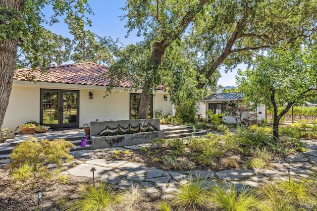 rear view of house with french doors