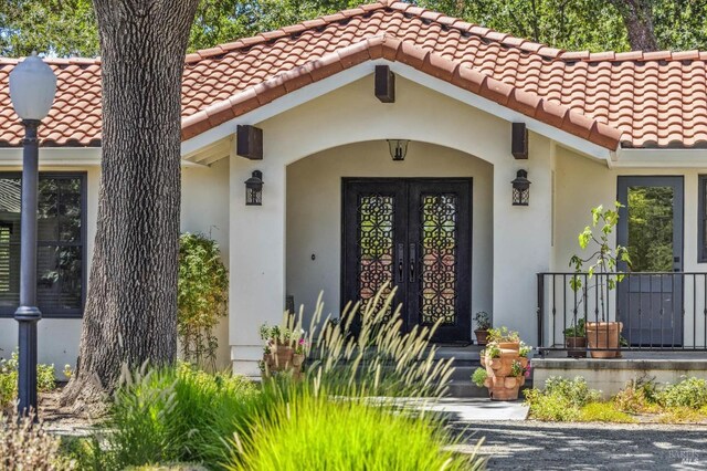 entrance to property featuring french doors