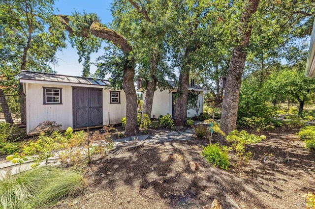 view of front of home with a storage unit