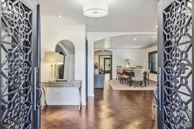 foyer with dark hardwood / wood-style floors