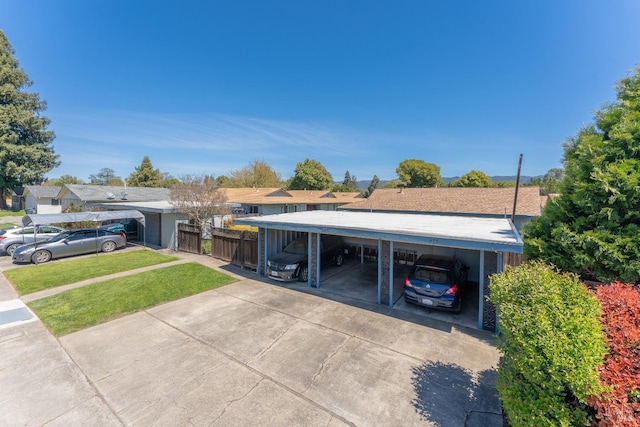 exterior space featuring a carport and a yard