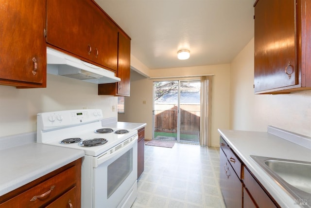 kitchen featuring white electric stove and sink