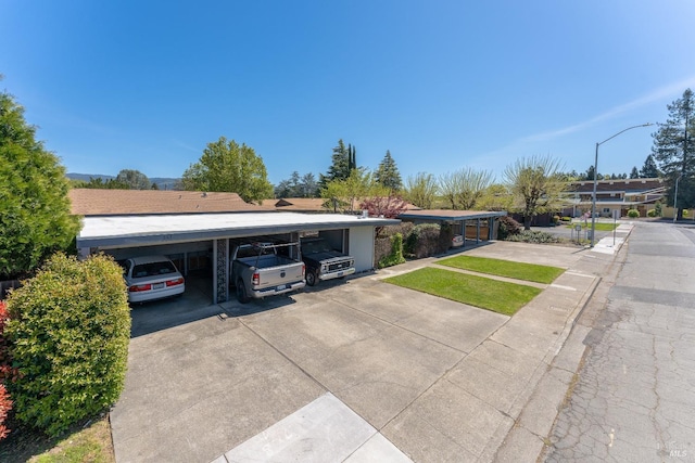 single story home with a carport