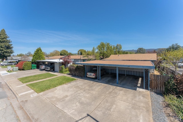 ranch-style house featuring a carport