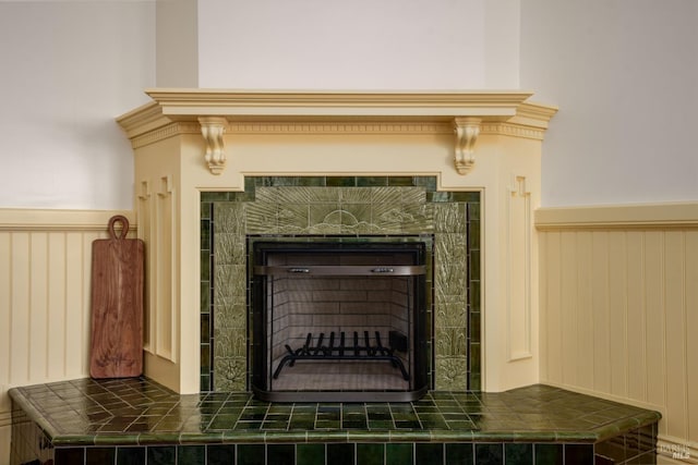 details featuring a tile fireplace