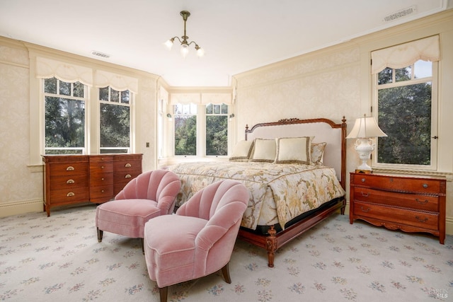 bedroom featuring light carpet, a notable chandelier, and multiple windows