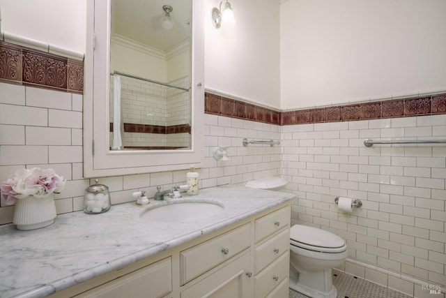 bathroom with oversized vanity, toilet, tile flooring, and tile walls