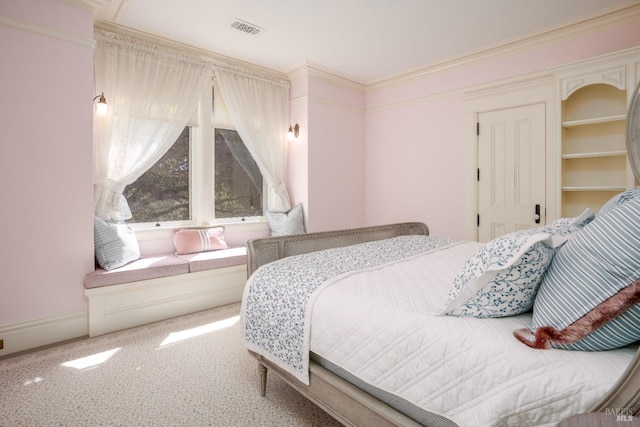 bedroom featuring crown molding and light colored carpet