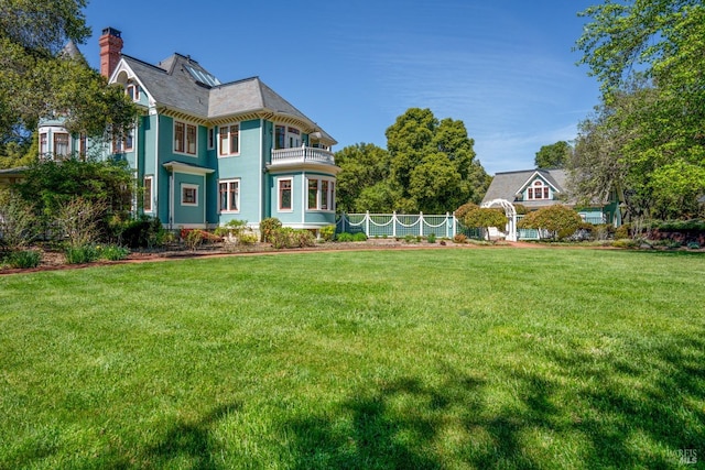 view of yard featuring a balcony