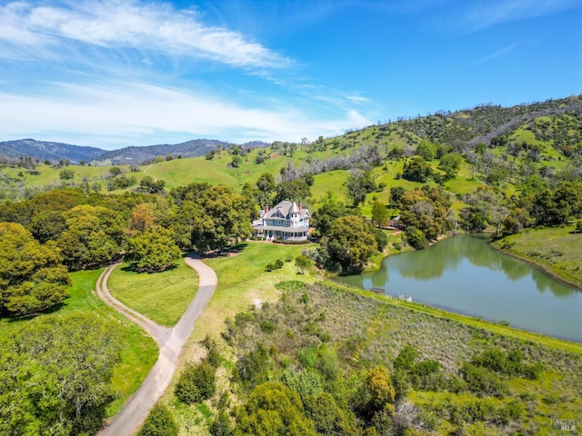 bird's eye view with a water and mountain view