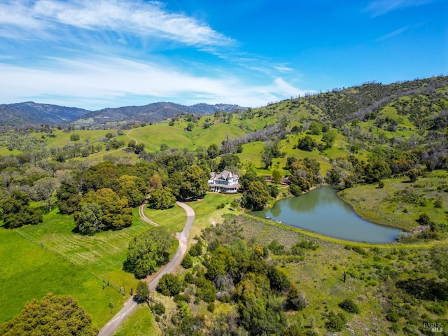 bird's eye view with a water and mountain view