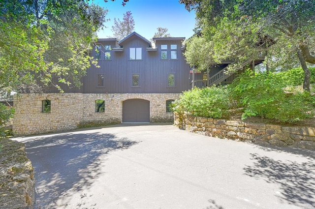 view of side of property featuring a garage