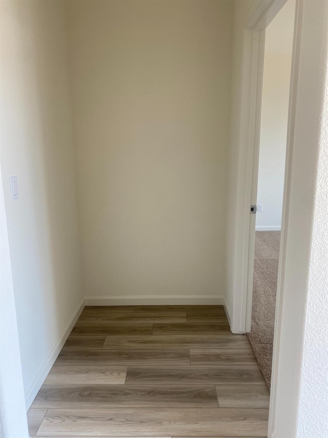 unfurnished room with light wood-type flooring