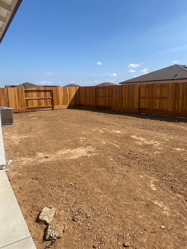 view of yard featuring central AC