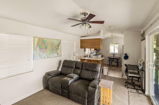 living room featuring lofted ceiling, ceiling fan, and light tile floors