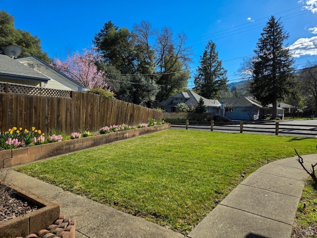 view of yard with fence