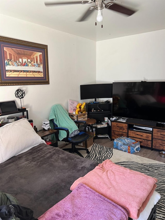 bedroom featuring hardwood / wood-style flooring and ceiling fan