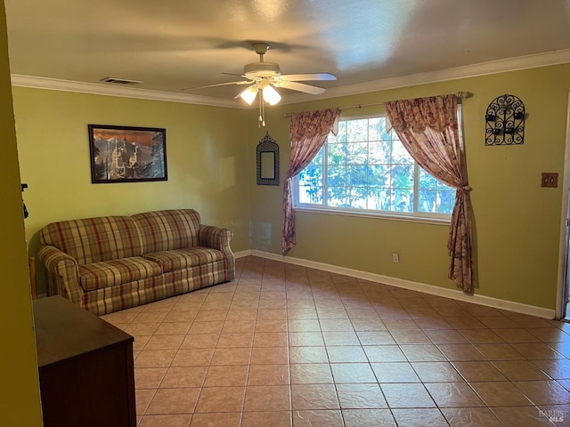 living room featuring ceiling fan, ornamental molding, and light tile patterned floors