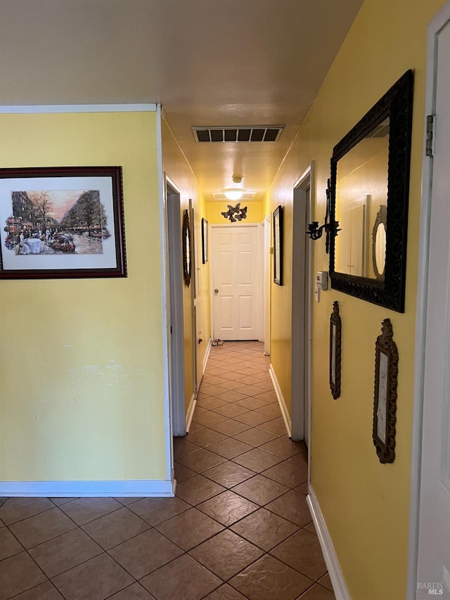 hall with tile patterned flooring