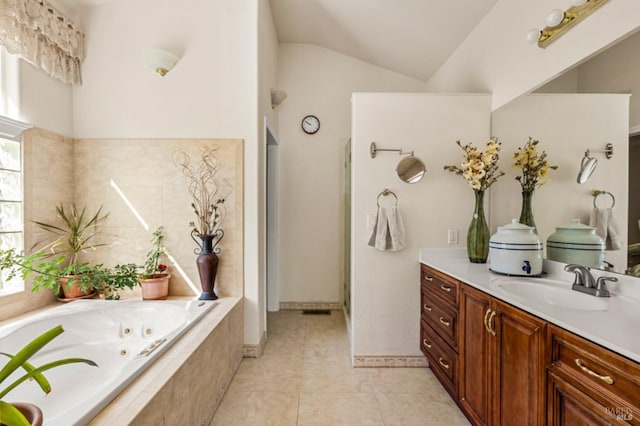 bathroom with vanity, toilet, tile flooring, and tile walls