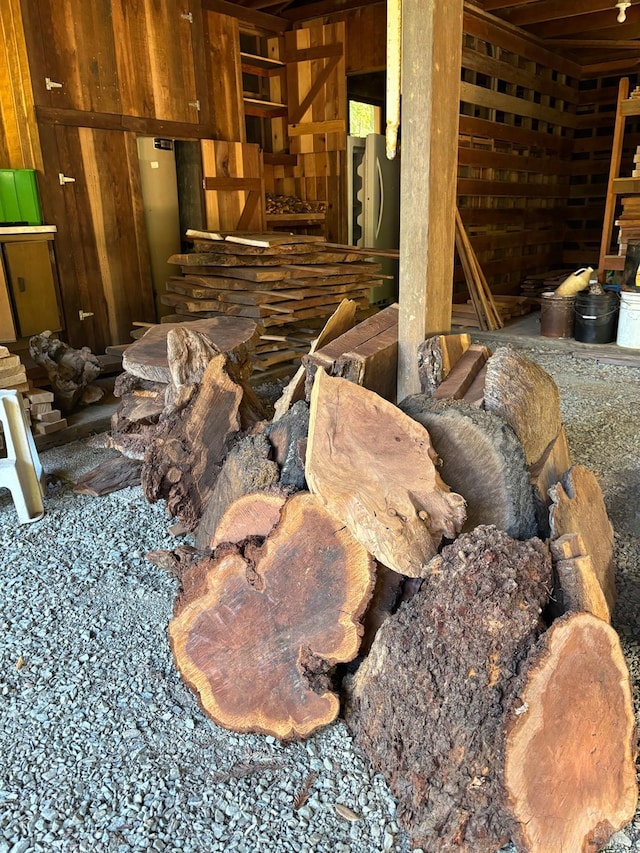 misc room featuring wooden walls