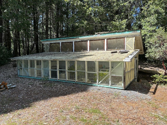 rear view of house with a sunroom