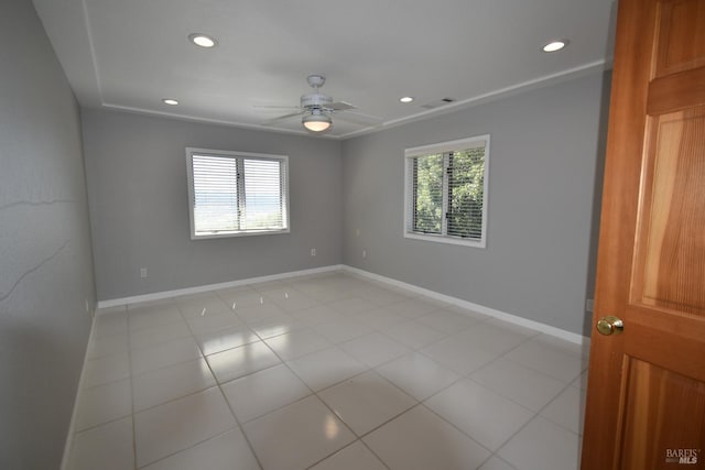 tiled empty room with ceiling fan