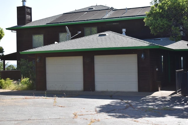 exterior space with a garage