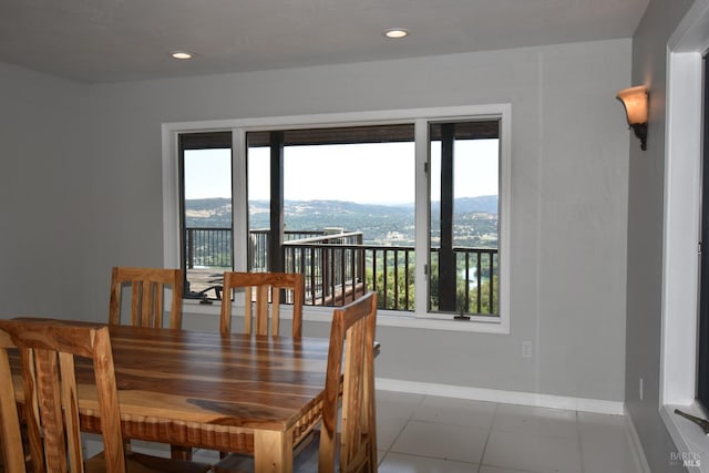 tiled dining space with a mountain view