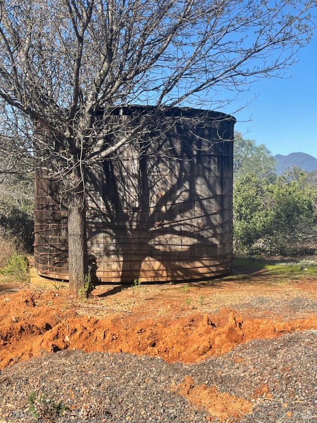 view of property exterior featuring a mountain view