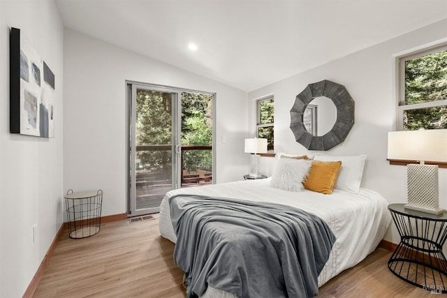 bedroom with recessed lighting, wood finished floors, visible vents, baseboards, and vaulted ceiling