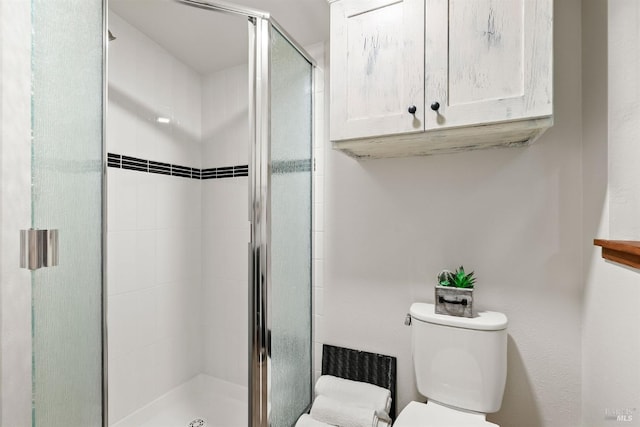 full bath with a shower stall and toilet