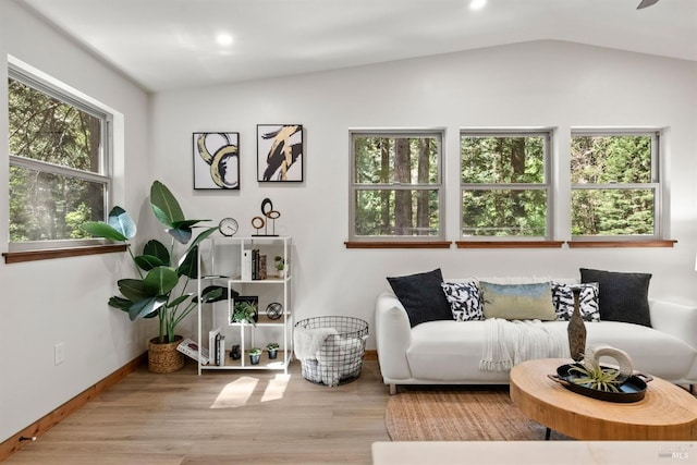 sitting room with baseboards, vaulted ceiling, wood finished floors, and recessed lighting