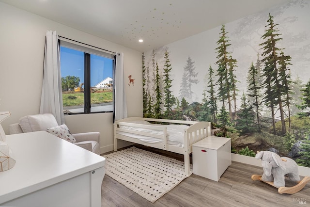 bedroom with light hardwood / wood-style flooring