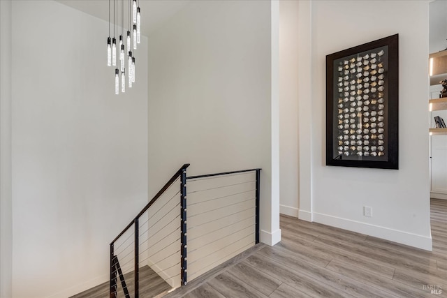 stairs featuring light wood-type flooring