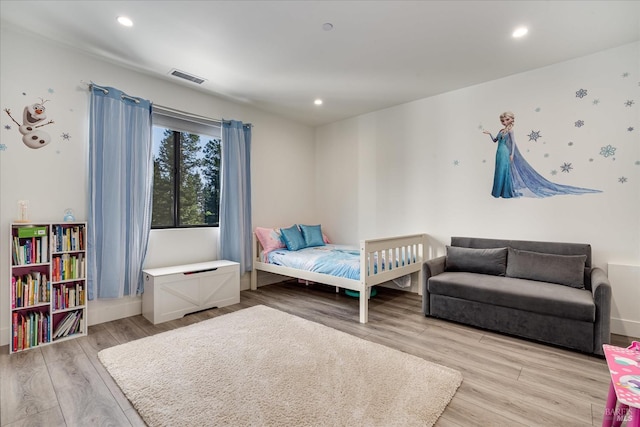 bedroom with light wood-type flooring