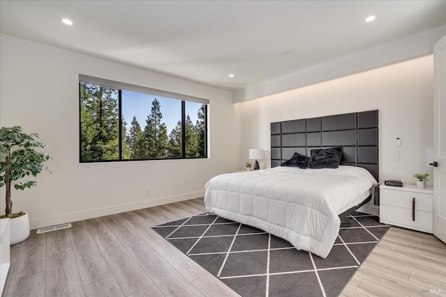 bedroom with light hardwood / wood-style floors