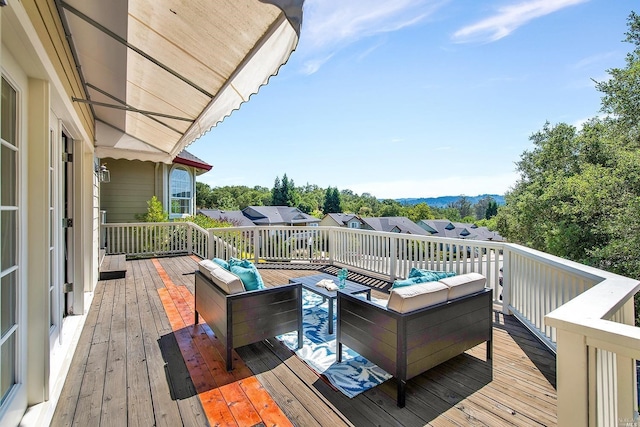 wooden terrace featuring an outdoor hangout area