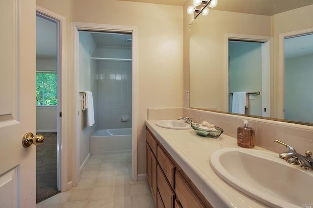 bathroom featuring vanity, a bathing tub, and tile patterned floors