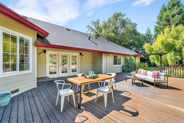 wooden deck featuring an outdoor living space and french doors