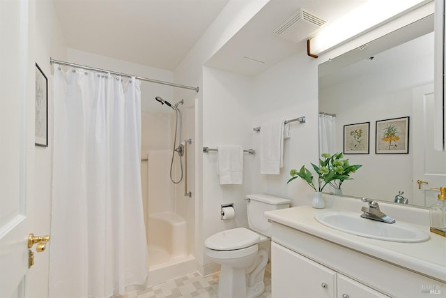 bathroom with tile flooring, vanity with extensive cabinet space, toilet, and a shower with shower curtain