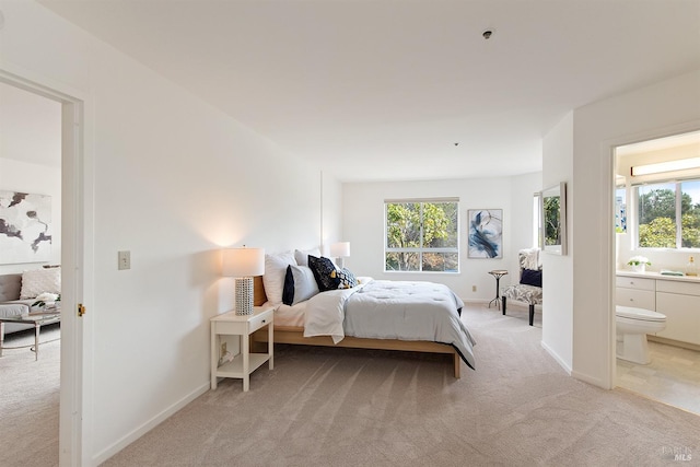 bedroom featuring carpet floors and ensuite bathroom