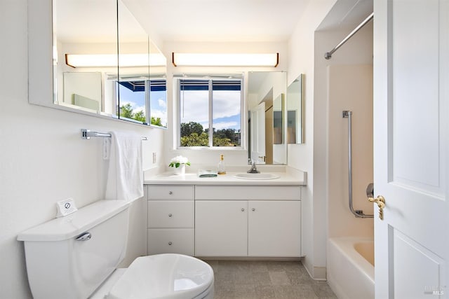 full bathroom with bathtub / shower combination, vanity, and toilet