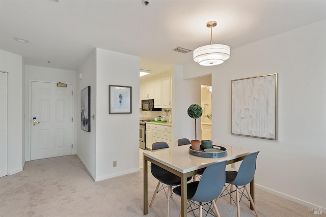 view of carpeted dining space