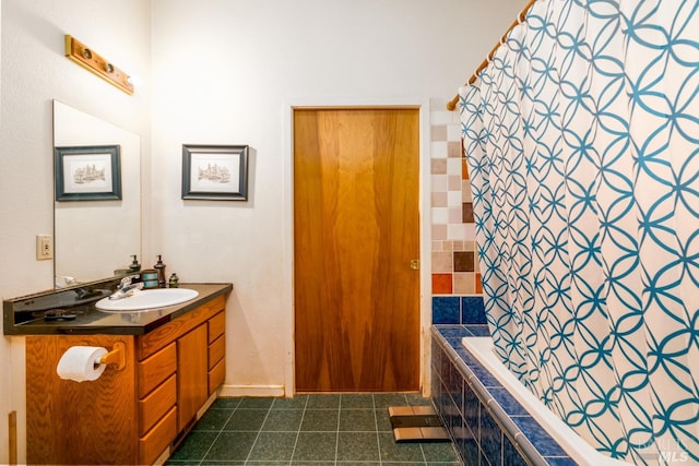 bathroom featuring vanity with extensive cabinet space and tile flooring