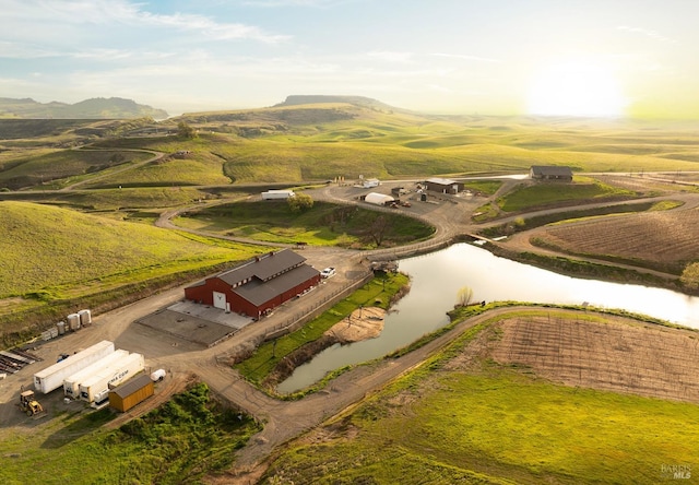 aerial view featuring a rural view and a water view