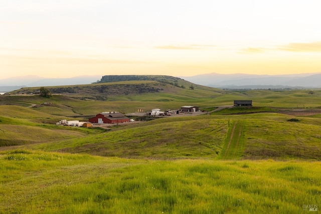 birds eye view of property with a rural view