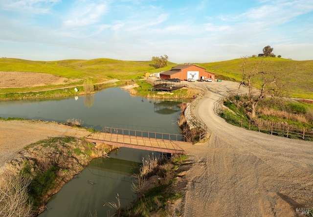 exterior space with a water view and a rural view