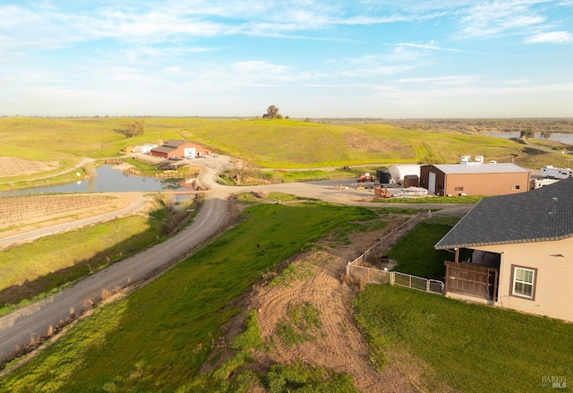 aerial view with a rural view and a water view