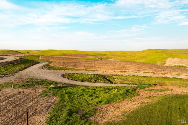 birds eye view of property featuring a rural view and a water view